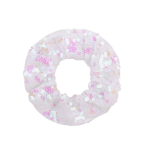 Detail of white mesh scrunchie featuring pink and gold shimmering fishtail sequins