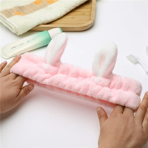 Pink plush bunny ear headband for face washing with soft elastic coral fleece texture