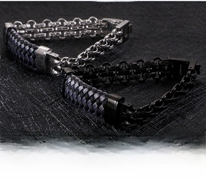 Detail of vintage black and silver stainless steel braided bracelet with clasp