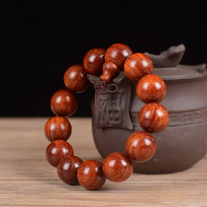 Detailed view of 18mm red sandalwood Buddhist beads with fine small hole craftsmanship