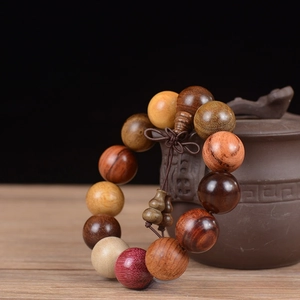 Detailed close-up of 18mm multi-wood prayer beads with traditional Chinese knot