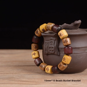 Detail of 15mm multicolored wooden barrel beads with engraved Buddhist scriptures
