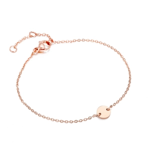 Detail of adjustable rose gold stainless steel bracelet with a round blank charm disc