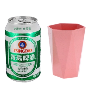 Pink hexagonal wheat straw mouthwash cup next to a 330ml can for size reference