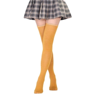 Detail of mustard yellow knit over-the-knee socks paired with a plaid pleated skirt