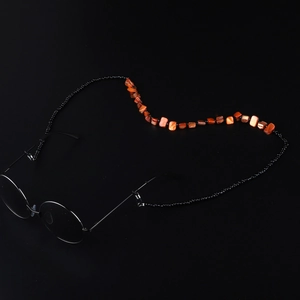 Minimalist handmade beaded shell sunglasses chain with black beads and amber stone accents