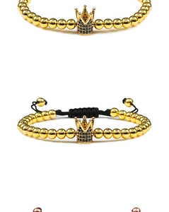 Detail of rose gold braided bracelet featuring micro-pave crown beads and black stones