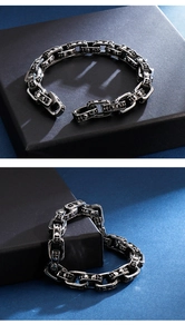 Detailed macro view of vintage skull embossed links on punk stainless steel men's bracelet