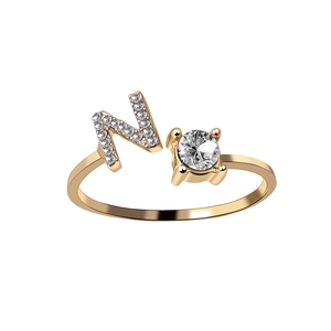 Adjustable golden ring featuring letter N with pavé crystals and a round solitaire zircon