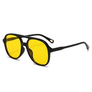 Retro double-bridge pilot sunglasses with black frames and vibrant yellow lenses