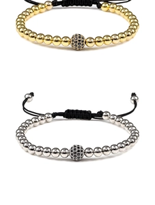 Detail of adjustable woven bracelets with gold and silver beads and micro-pave zircon spheres