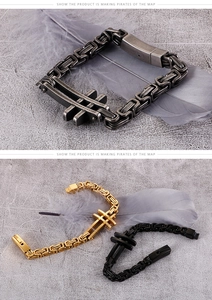 Detail of Byzantine style stainless steel bracelets in silver, gold and black with crosses