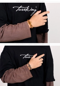 Detail of cross pendant link bracelets in gold and silver steel for men's fashion