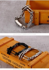 Macro detail of men's stainless steel Byzantine chain bracelet with magnetic buckle