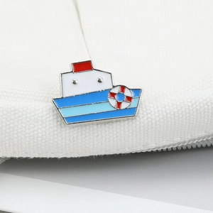 Detail of nautical ship brooch in white and blue enamel with lifebuoy design