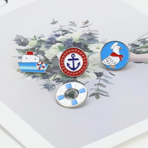 Detailed set of four nautical enamel pins including ship, anchor, duck and lifebuoy designs
