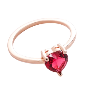 Elegant rose gold heart ring with a vibrant red heart-shaped gemstone in three-prong setting
