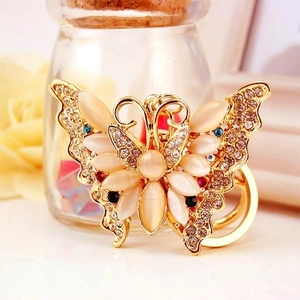 Exquisite gold butterfly keychain with cat eye stones and rhinestones for bags