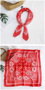Detail view of red paisley square silk scarf in folded and flat display states