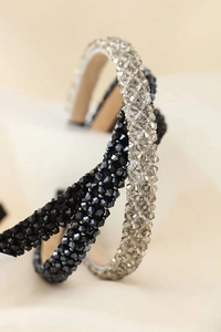 Close-up of sparkling crystal beads on black and champagne hairbands with soft lining