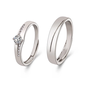 Adjustable couple rings with round cut zircon and brushed metal finish on white background
