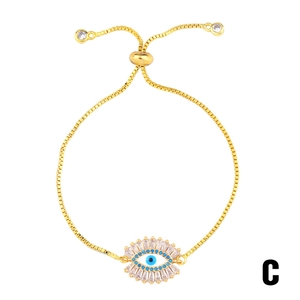 Adjustable golden box chain bracelet featuring an Evil Eye pendant with blue enamel and zircons