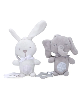 Detail of plush rabbit and elephant toys with teething rings and patterned bell bellies