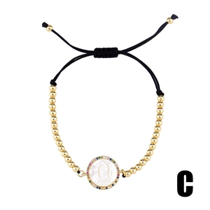 Rainbow crystal gold beaded bracelet with Virgin Mary medallion on white background