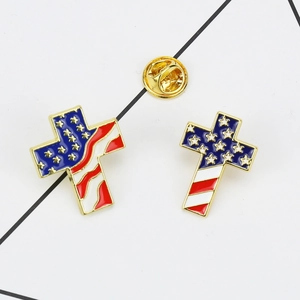 Detail of cross-shaped enamel brooches with US flag pattern and golden butterfly clutches