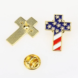 Detailed front and back view of metal cross brooch with US flag enamel design and gold clutch