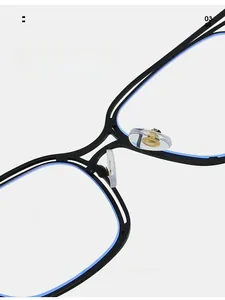 Close-up of soft silicone nose pads and blue-trimmed matte black eyeglass frame