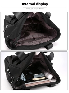 Detail view of large nylon tote bag interior showing multi-compartment storage capacity