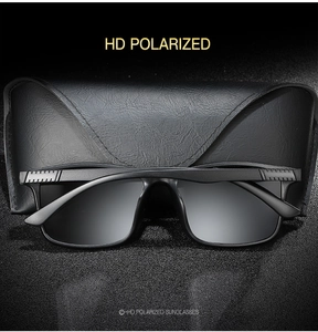 Close-up of black polarized sports sunglasses and leather-textured protective case