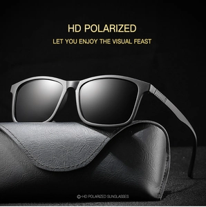 Detailed view of HD polarized sports sunglasses resting on a premium leather case