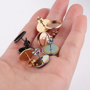 Detailed view of stainless steel earring studs and backs in gold, rose gold and rainbow finishes