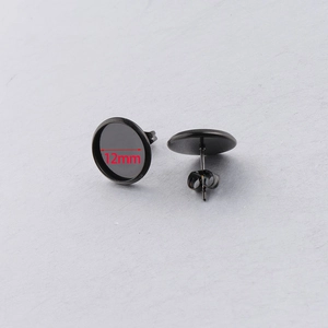 Detail of 12mm matte black stainless steel earring bezel tray with butterfly backs