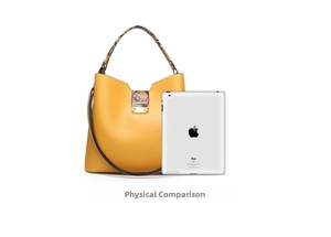 Size comparison of the yellow leather tote bag next to an iPad for dimension reference