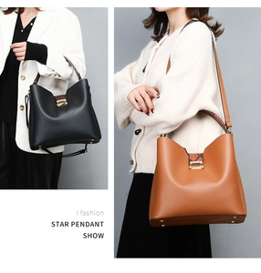 Detail showing the large capacity tote bag in black and brown on a model