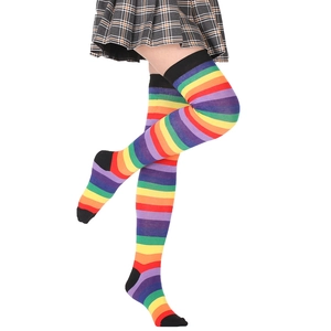 Close-up of rainbow striped over-knee socks showing knit texture and elastic fit on model