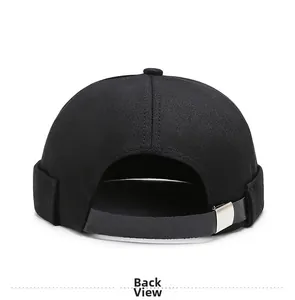 Back view of black cotton docker hat showing leather strap and silver metal buckle detail