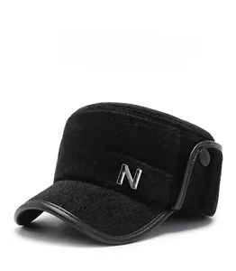 Detail of winter thermal flat top hat featuring black faux fur and metal N logo