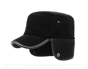 Detail of winter men's ear flap cap with silver N metal logo and faux leather piping