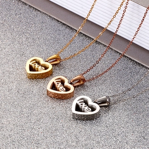 Three-color heart pendant necklaces with Love lettering in gold, rose gold and silver