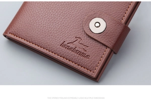 Detail of vintage brown pebble leather wallet with magnetic buckle and embossed horse logo