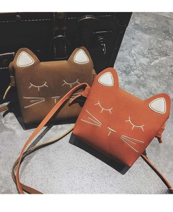 Close-up of cat-shaped crossbody bags featuring detailed embroidery and 3D ears