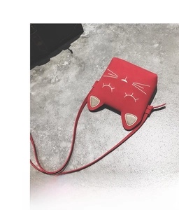Detail of red PU leather girls purse with cat ear design and cat face embroidery