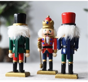 Detailed view of three 15cm wooden nutcracker ornaments in vibrant red and green colors