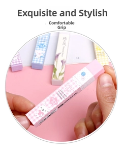 Detailed macro view of a colorful rectangular eraser with pink grid and cute rabbit patterns