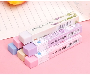 Stack of colorful long rectangular erasers in pastel blue, pink, and yellow for students