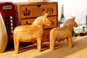 Set of two Nordic wooden Dala horse ornaments with natural texture for home decor